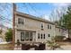 A lovely backyard featuring a brick patio, perfect for outdoor seating and entertaining with mature trees surrounding the yard at 112 Parkmeadow Dr, Cary, NC 27519