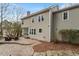 The outdoor space features a brick patio and natural stone walkway, surrounded by mature trees and low growing bushes at 112 Parkmeadow Dr, Cary, NC 27519