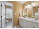Bathroom featuring a double sink vanity, white cabinets and tile floors at 112 Parkmeadow Dr, Cary, NC 27519
