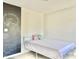 Bright bedroom with neutral walls, chalkboard accent wall and minimalist furnishings at 112 Parkmeadow Dr, Cary, NC 27519