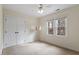 Bright bedroom with double door closet, two windows, and light beige walls at 112 Parkmeadow Dr, Cary, NC 27519