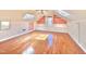 Attic bonus room with wood floors, built-in shelves and a ceiling fan at 112 Parkmeadow Dr, Cary, NC 27519