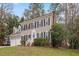 Charming two-story home with a manicured front lawn, complemented by tasteful landscaping and a white picket fence at 112 Parkmeadow Dr, Cary, NC 27519