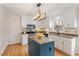 Stylish kitchen featuring granite countertops, stainless steel appliances, and modern lighting at 112 Parkmeadow Dr, Cary, NC 27519