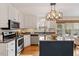 Well-appointed kitchen with stainless steel appliances, granite countertops, and custom cabinetry at 112 Parkmeadow Dr, Cary, NC 27519