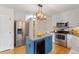 Beautiful kitchen featuring an island with granite countertops and stainless steel appliances at 112 Parkmeadow Dr, Cary, NC 27519