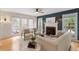Inviting living room features a cozy fireplace and comfortable seating area with plenty of natural light at 112 Parkmeadow Dr, Cary, NC 27519