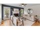 Bright living room boasts hardwood floors, a decorative fireplace, and sophisticated decor at 112 Parkmeadow Dr, Cary, NC 27519