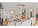 Open living room with hardwood floors, neutral tones, and seamless transition to the staircase at 112 Parkmeadow Dr, Cary, NC 27519