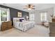 Spacious main bedroom with decorative wall, plush bedding, and bright natural light at 112 Parkmeadow Dr, Cary, NC 27519