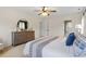 Large main bedroom with neutral walls, a ceiling fan, and views of the ensuite bathroom at 112 Parkmeadow Dr, Cary, NC 27519