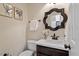 Elegant powder room with stylish mirror, modern fixtures, and tasteful decor at 112 Parkmeadow Dr, Cary, NC 27519