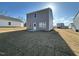 This backyard has a concrete patio and an expansive yard, with visible houses in the background at 1161 Centerview Drive, Nashville, NC 27856