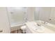 This bathroom has a shower and tub, toilet, and a large mirror above the vanity with storage below at 1161 Centerview Drive, Nashville, NC 27856