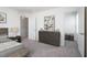 This bedroom features a large dresser with art above and an open door leading to another area at 1161 Centerview Drive, Nashville, NC 27856