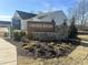Welcome to Cardinal Woods, a Starlight community, with a sign surrounded by beautiful flowers and landscaping at 1161 Centerview Drive, Nashville, NC 27856