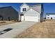 Charming two-story home featuring gray siding, a two-car garage, and a well-manicured front lawn at 1161 Centerview Drive, Nashville, NC 27856