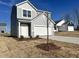 Beautiful two-story home with gray siding, a two-car garage, and a tree-lined yard at 1161 Centerview Drive, Nashville, NC 27856