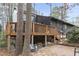 A brick patio is in the backyard, surrounded by trees at 118 Flora Mcdonald Ln, Cary, NC 27511
