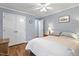 Comfortable bedroom with ample closet space, hardwood floors, and a neutral color scheme at 118 Flora Mcdonald Ln, Cary, NC 27511
