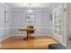 Dining room featuring hardwood floors, french doors, and chandelier at 118 Flora Mcdonald Ln, Cary, NC 27511
