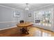 Dining room featuring hardwood floors, french doors, and chandelier at 118 Flora Mcdonald Ln, Cary, NC 27511