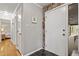 Hallway with black tiled floors, leading to the kitchen and bedroom at 118 Flora Mcdonald Ln, Cary, NC 27511