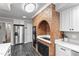 Kitchen featuring stainless steel refrigerator, white cabinets, and tile floors at 118 Flora Mcdonald Ln, Cary, NC 27511