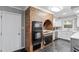 Kitchen features white cabinets, dark tile floors, and stainless steel sink at 118 Flora Mcdonald Ln, Cary, NC 27511