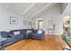 Bright living room with hardwood floors, neutral walls, and comfortable seating arrangement at 118 Flora Mcdonald Ln, Cary, NC 27511