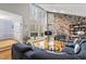Spacious living room showcasing a stone fireplace, large windows, and inviting furniture at 118 Flora Mcdonald Ln, Cary, NC 27511
