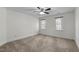 Inviting bedroom with carpet, ceiling fan, natural light, and neutral walls at 1196 Smith Creek Way, Wake Forest, NC 27587