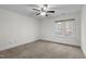 Bright bedroom featuring carpet, ceiling fan, and natural light from large window at 1196 Smith Creek Way, Wake Forest, NC 27587