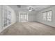 Spacious bonus room features neutral carpet, natural light, and a ceiling fan at 1196 Smith Creek Way, Wake Forest, NC 27587