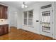 Bright breakfast nook with windows and a door to the deck at 1196 Smith Creek Way, Wake Forest, NC 27587