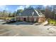 Exterior view of office building with well-maintained landscaping and ample parking spaces at 1196 Smith Creek Way, Wake Forest, NC 27587