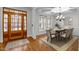 Traditional dining room showcasing beautiful hardwood floors, natural lighting and space for a table for six at 1196 Smith Creek Way, Wake Forest, NC 27587