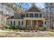 Inviting two-story home with stone accents and a covered porch at 1196 Smith Creek Way, Wake Forest, NC 27587