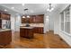 Beautiful kitchen with rich wood cabinetry and granite countertops at 1196 Smith Creek Way, Wake Forest, NC 27587