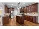 Spacious kitchen features stainless appliances and a center island at 1196 Smith Creek Way, Wake Forest, NC 27587