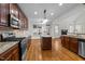 Open kitchen with an island and views to the living area at 1196 Smith Creek Way, Wake Forest, NC 27587
