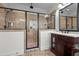 Luxurious primary bathroom features glass enclosed shower, vanity, and tile floors at 1196 Smith Creek Way, Wake Forest, NC 27587