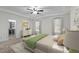 Serene main bedroom offering plush carpeting, natural light, walk in closet, and tray ceilings at 1196 Smith Creek Way, Wake Forest, NC 27587