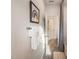 Bright bathroom with neutral paint, a tub with curtain, and towel rack at 1205 Coral Cay Bnd, Wake Forest, NC 27587