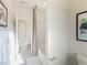 Bright bathroom with neutral paint, a tub with curtain, and art at 1205 Coral Cay Bnd, Wake Forest, NC 27587