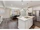 Open kitchen featuring a central island, stainless steel appliances, and stylish pendant lighting at 1205 Coral Cay Bnd, Wake Forest, NC 27587