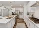 Well-equipped kitchen with white cabinetry, stainless appliances, and sleek countertops at 1205 Coral Cay Bnd, Wake Forest, NC 27587