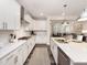 Modern kitchen with white cabinets, stainless steel appliances, and a functional layout at 1205 Coral Cay Bnd, Wake Forest, NC 27587