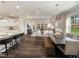 Open-concept living space featuring a modern kitchen, dining area, and living room at 1205 Coral Cay Bnd, Wake Forest, NC 27587