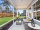 Cozy screened patio with comfortable seating, perfect for enjoying the outdoors at 1205 Coral Cay Bnd, Wake Forest, NC 27587